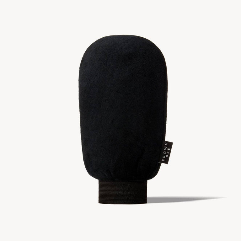 Black microfiber Brown Bee application mitt standing upright against a plain background