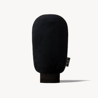 Black microfiber Brown Bee application mitt standing upright against a plain background